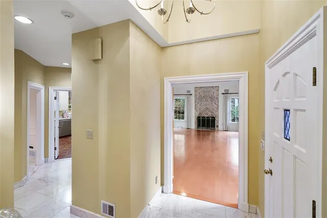 a view of a hallway view with three rooms