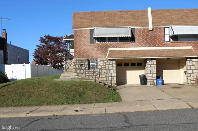 a view of multiple houses with a street