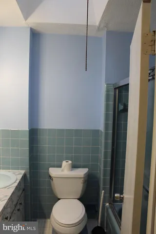 a bathroom with a toilet and a sink