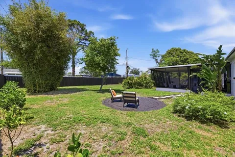 a view of a backyard with sitting area