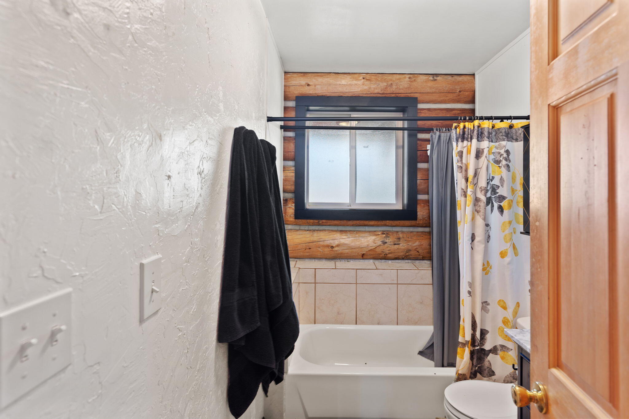 5737 Rockydale Road Cave Junction, OR 97523 - Photo 11 of 39 a bathroom with a granite countertop sink toilet and shower