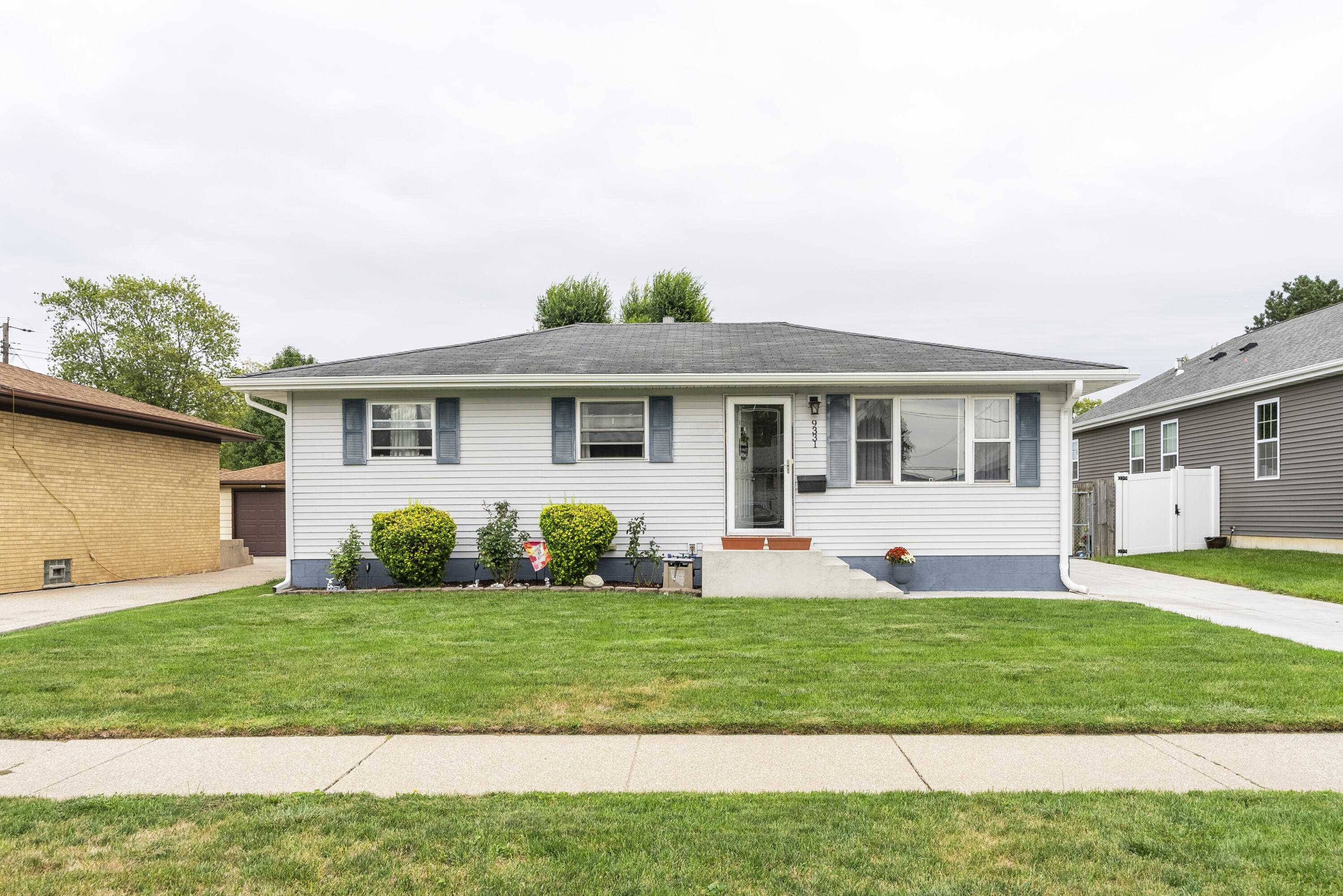 9331 Farmer Drive Highland, IN 46322 - Photo 1 of 19 a front view of a house with a yard and garage