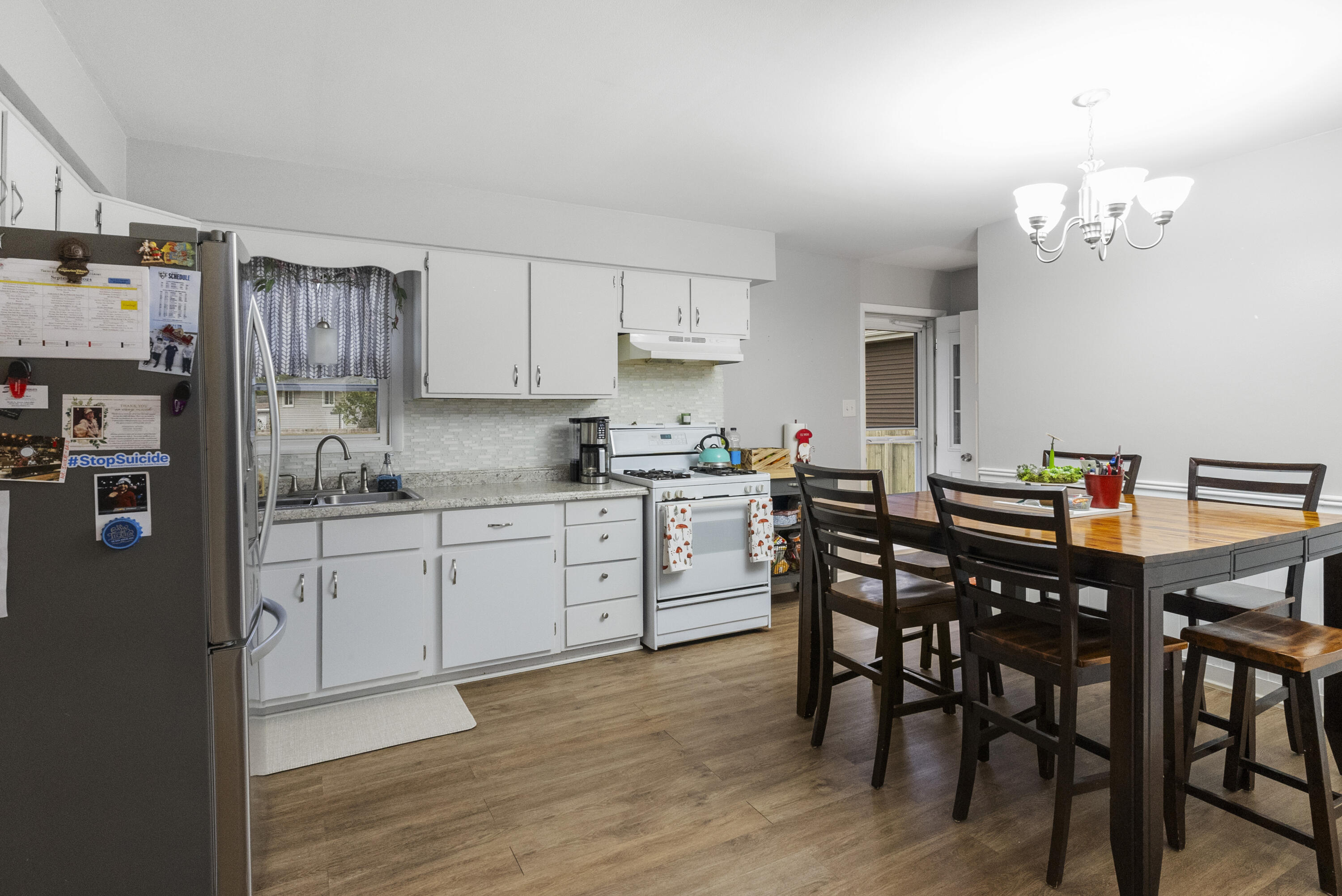 9331 Farmer Drive Highland, IN 46322 - Photo 5 of 19 a kitchen with a table and chairs in it