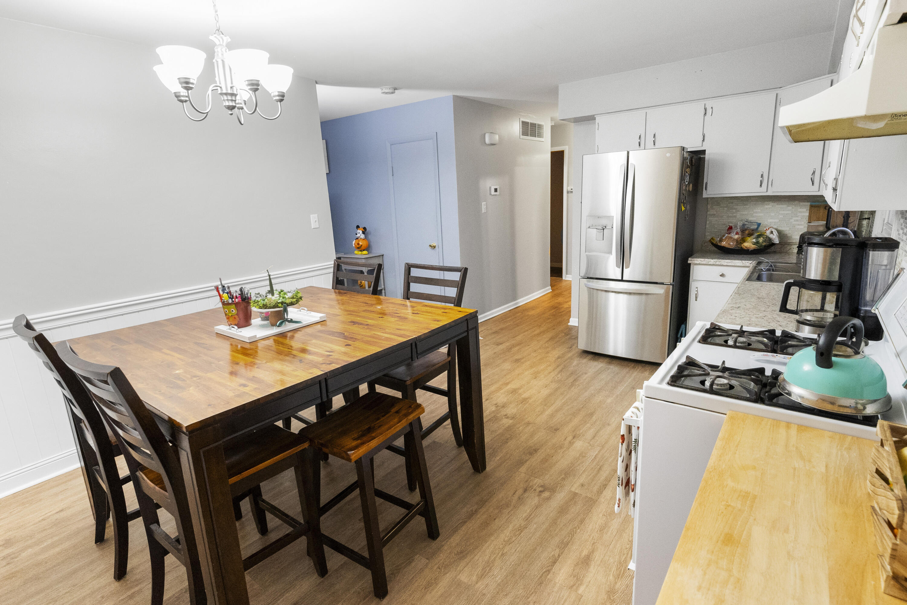 9331 Farmer Drive Highland, IN 46322 - Photo 6 of 19 a kitchen with a dining table and chairs