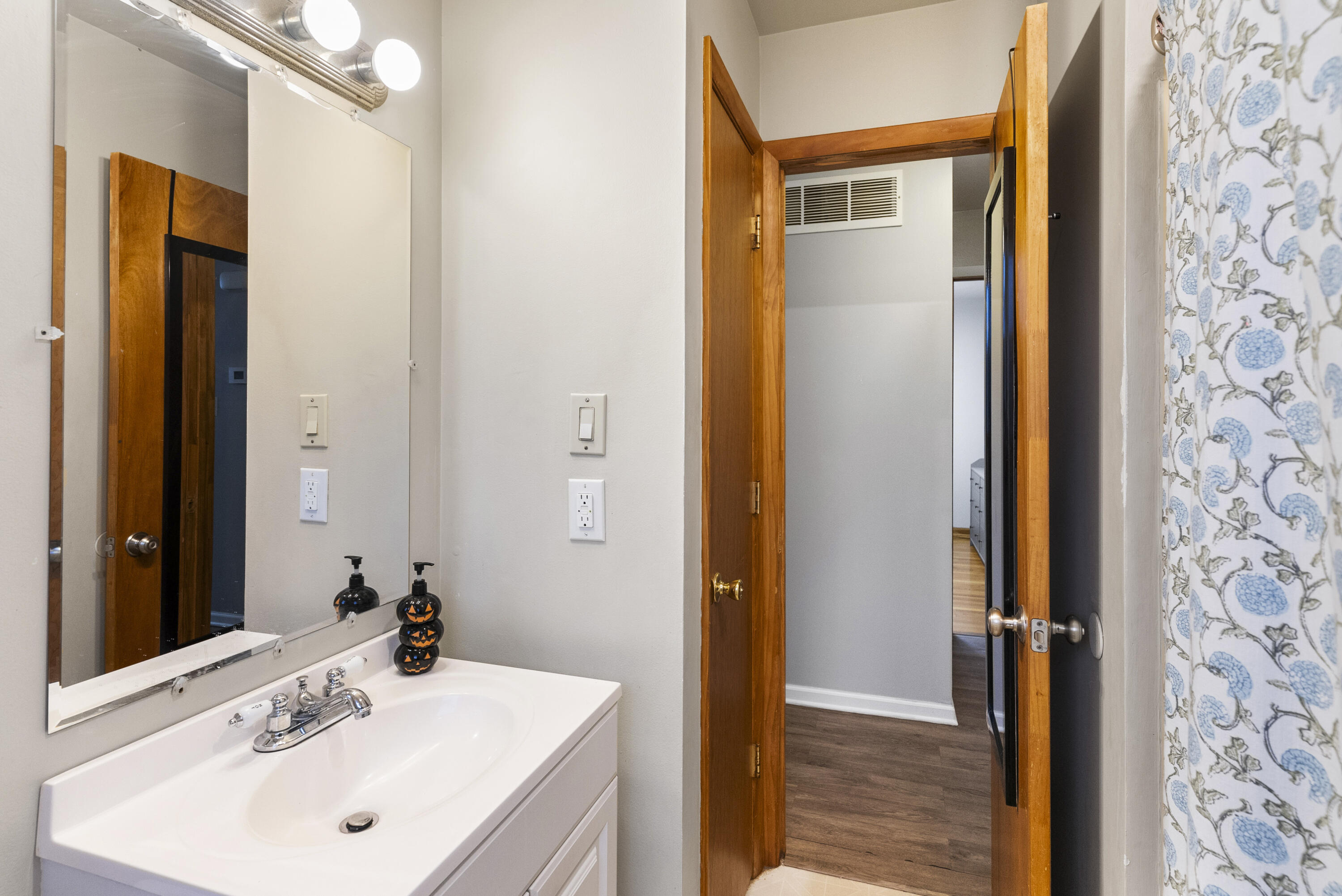 9331 Farmer Drive Highland, IN 46322 - Photo 8 of 19 a bathroom with a sink a mirror and a shower