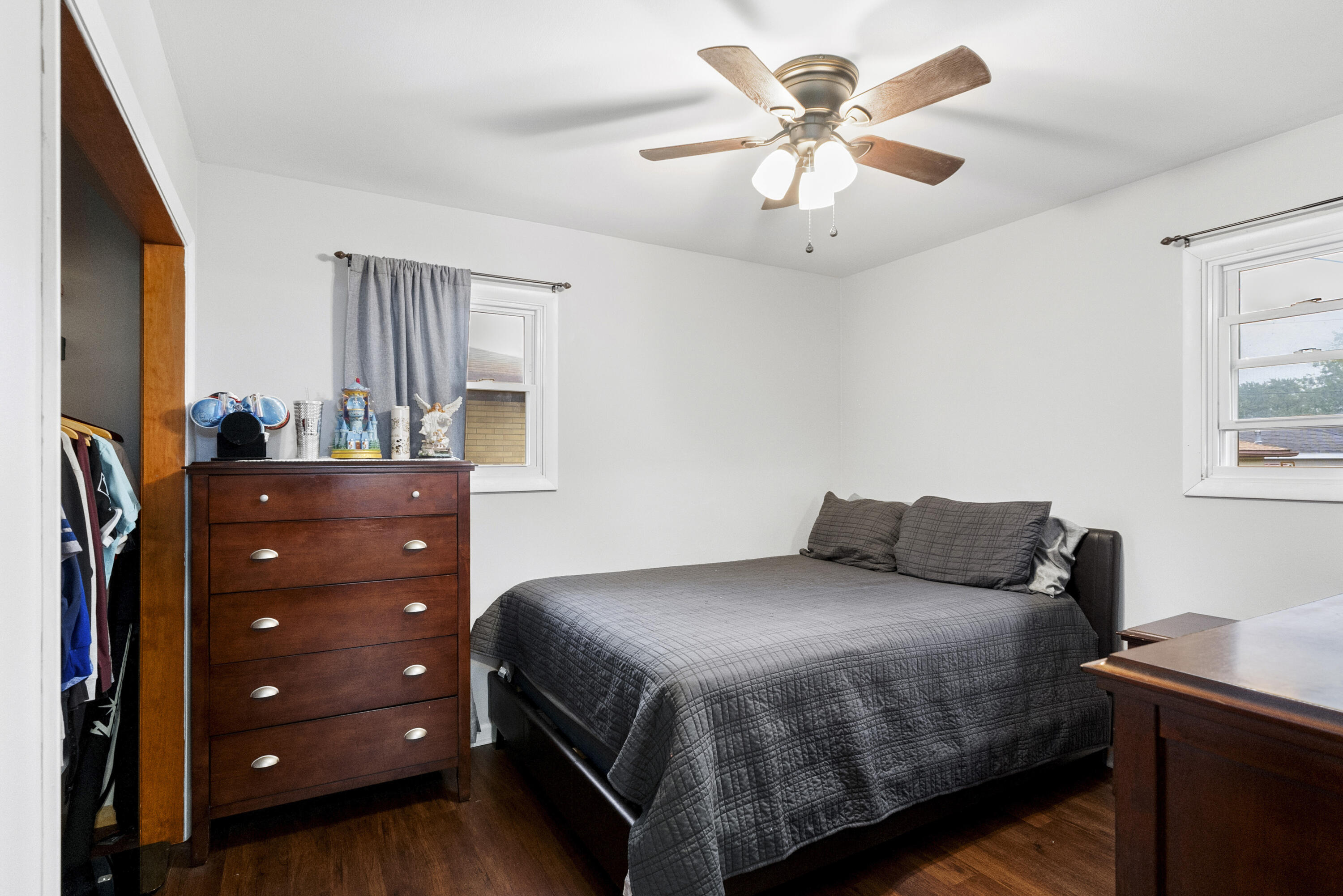 9331 Farmer Drive Highland, IN 46322 - Photo 10 of 19 a bedroom with a bed and a chandelier