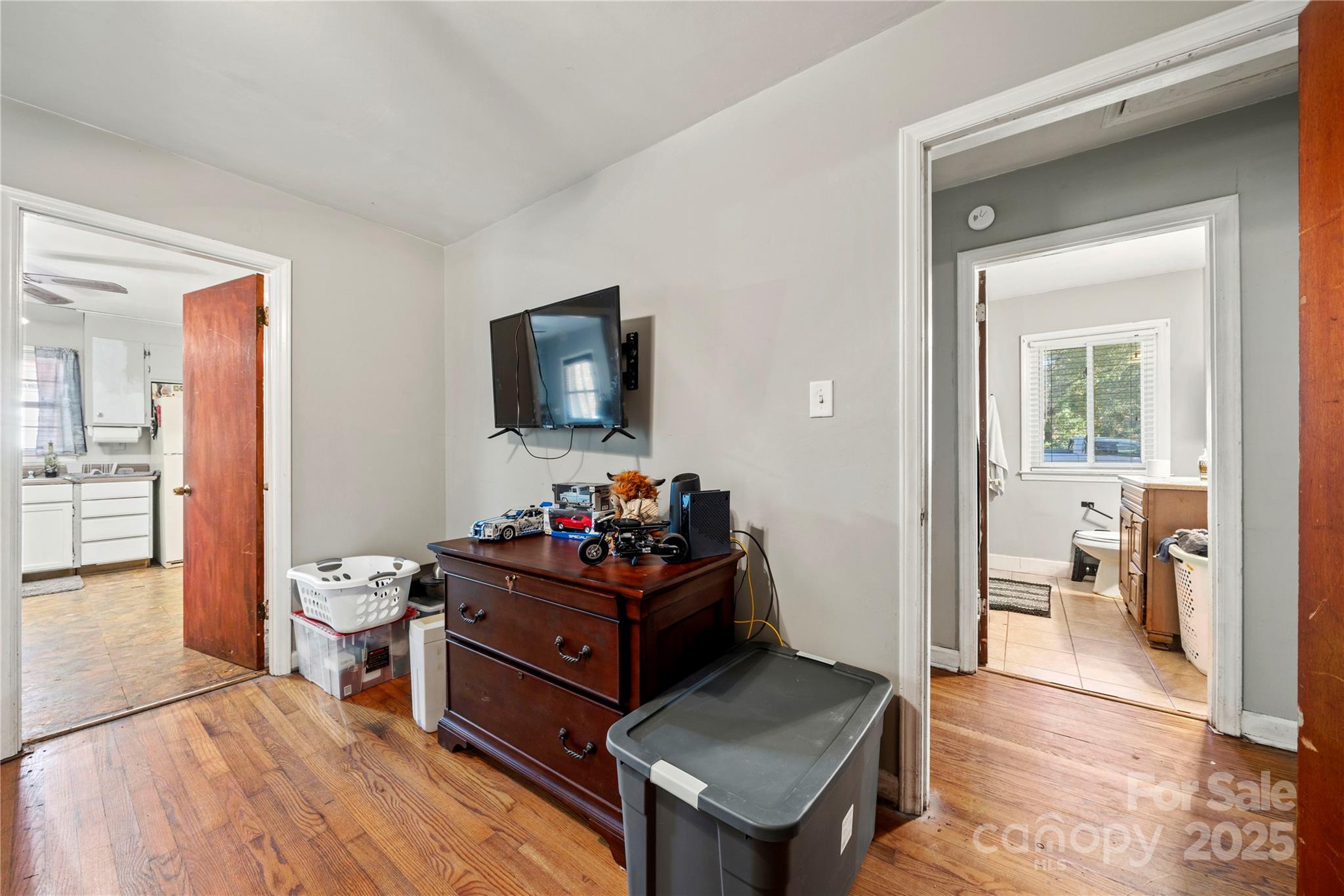 4838 Hidden Valley Road Charlotte, NC 28213 - Photo 11 of 22 a living room with furniture and a flat screen tv