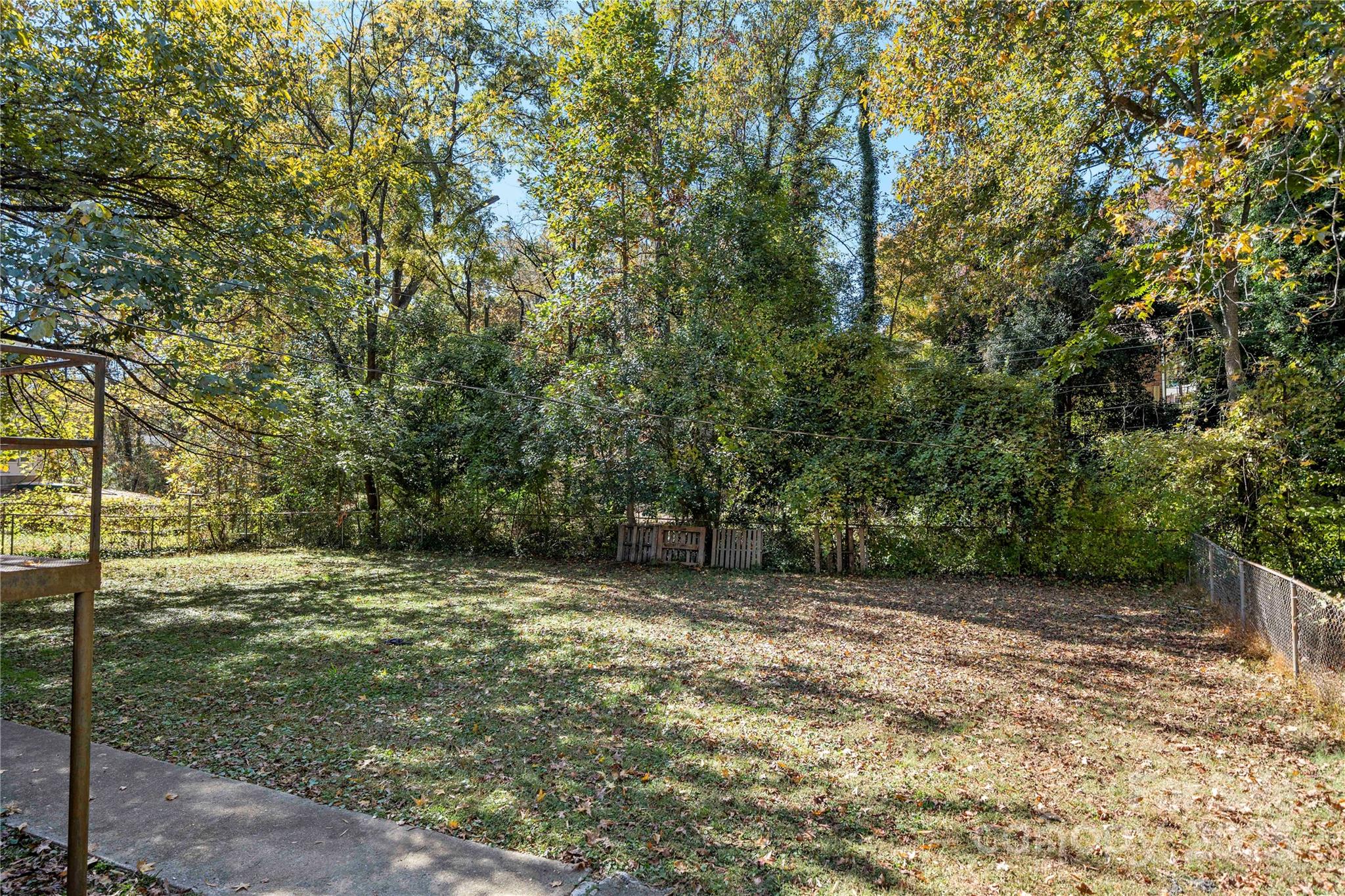 4838 Hidden Valley Road Charlotte, NC 28213 - Photo 18 of 22 a view of a yard with a tree