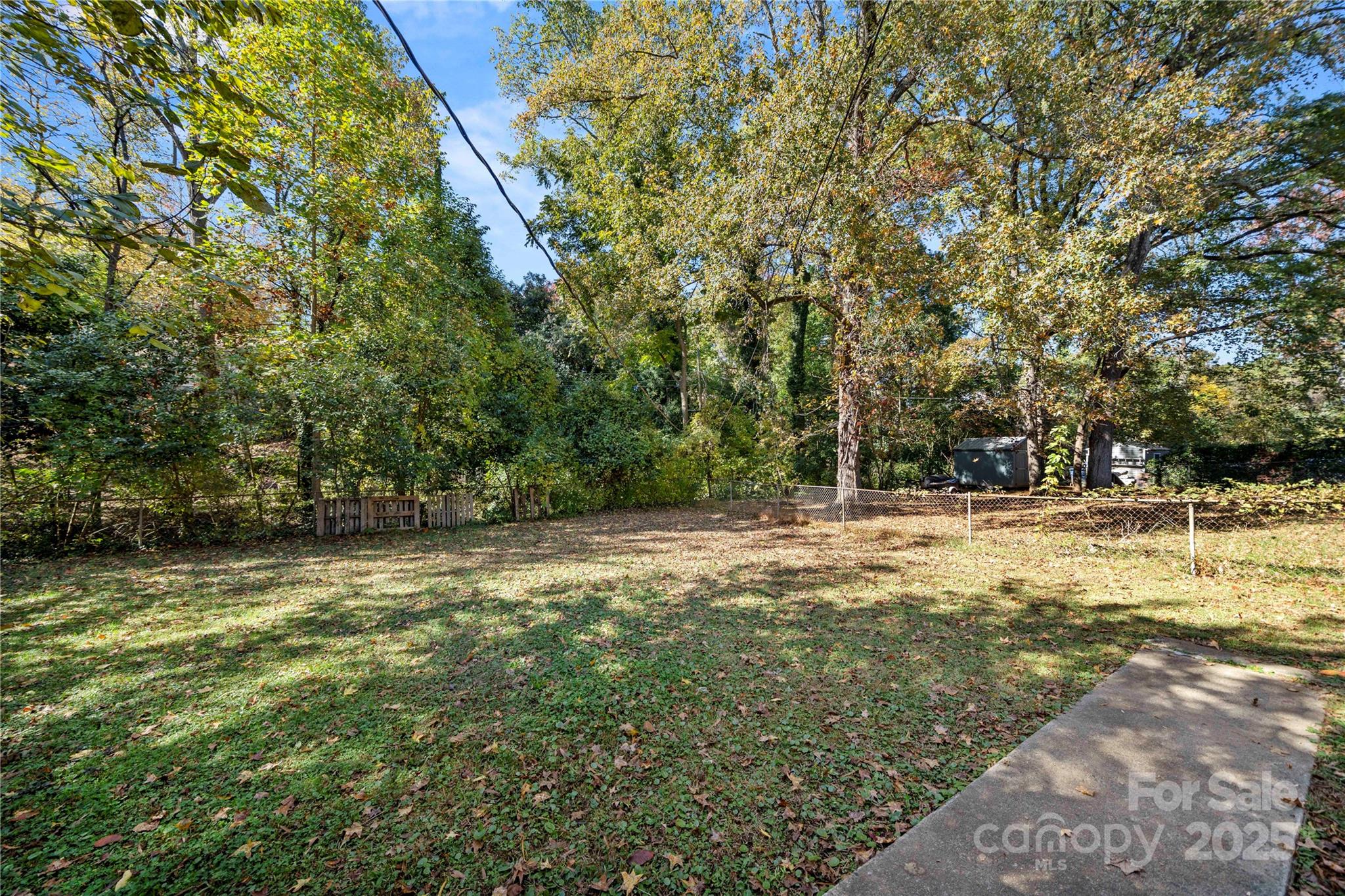 4838 Hidden Valley Road Charlotte, NC 28213 - Photo 19 of 22 a view of a trees with a yard