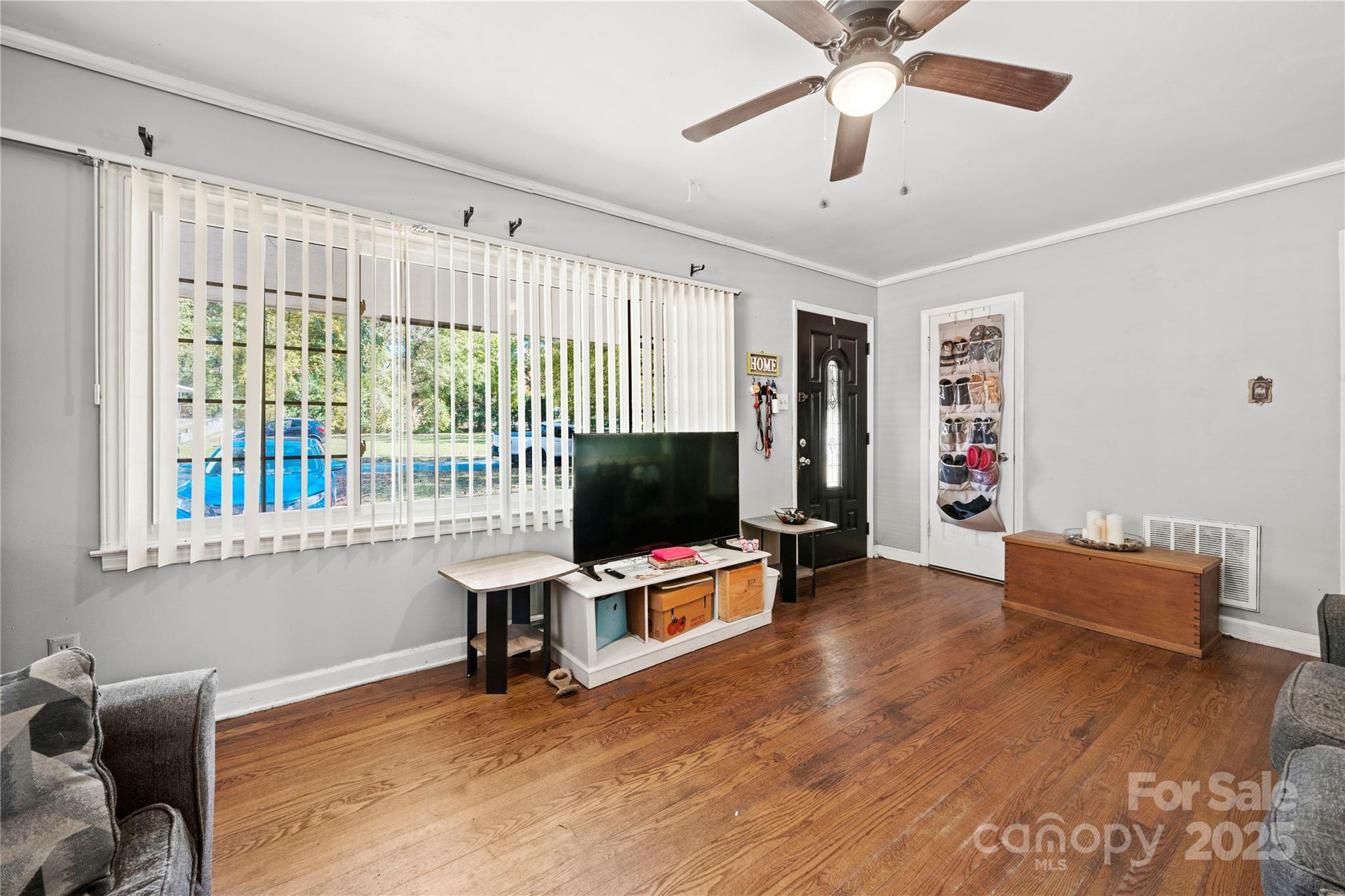 4838 Hidden Valley Road Charlotte, NC 28213 - Photo 4 of 22 a living room with furniture and a flat screen tv