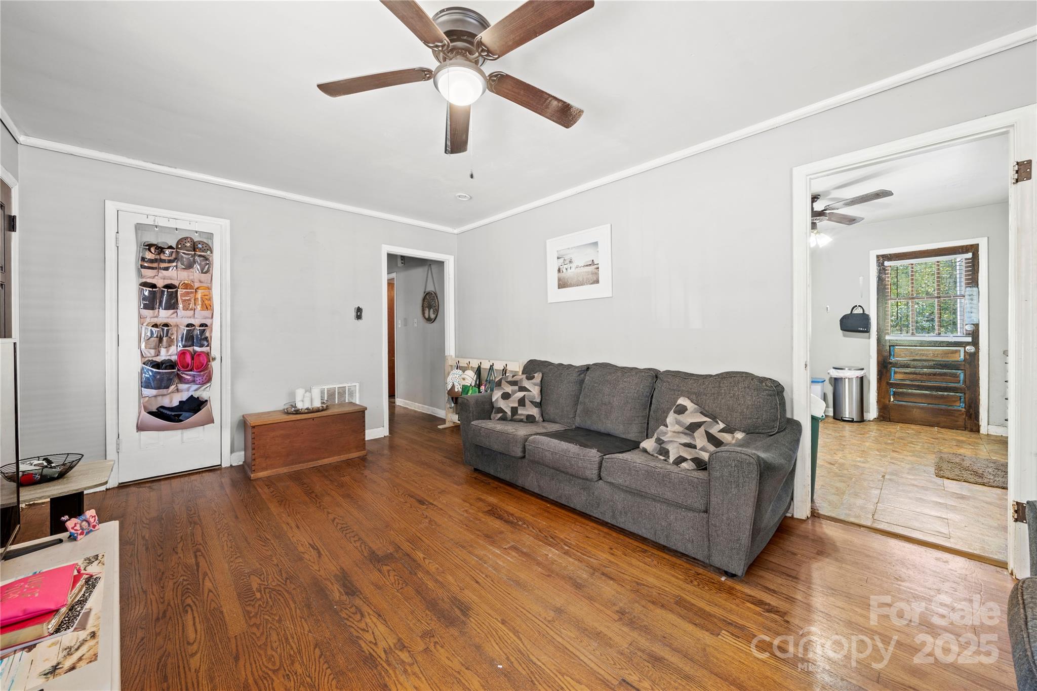 4838 Hidden Valley Road Charlotte, NC 28213 - Photo 5 of 22 a living room with furniture and a wooden floor