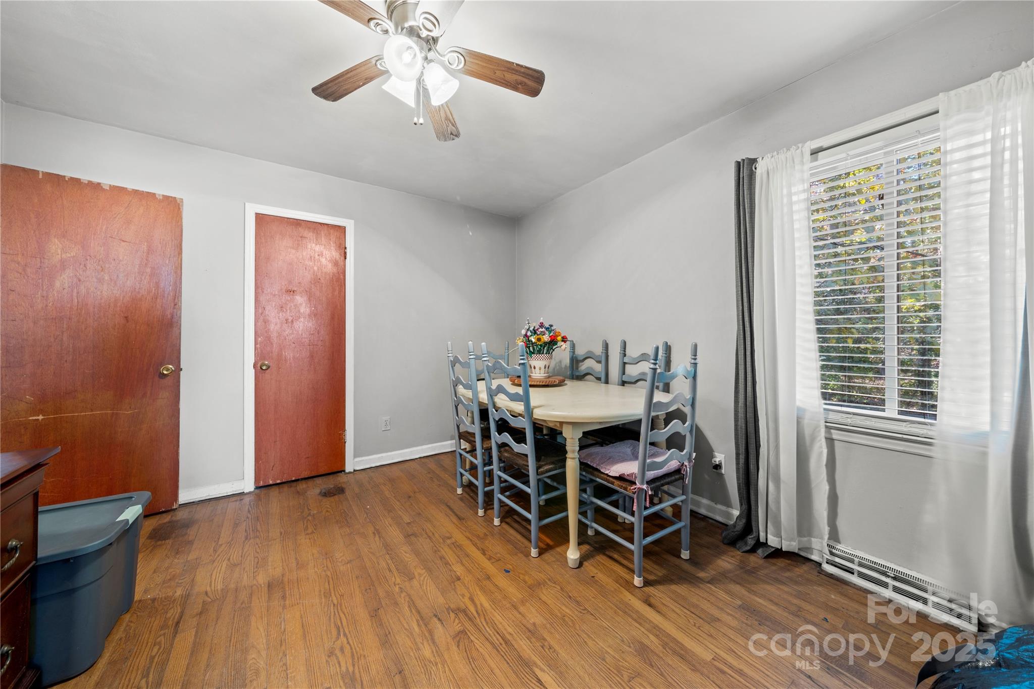 4838 Hidden Valley Road Charlotte, NC 28213 - Photo 10 of 22 a view of a dining room with furniture window and wooden floor