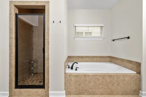 a bathroom with a sink vanity and mirror