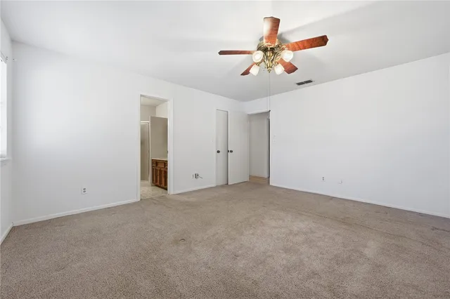 a bedroom with a bed and a closet