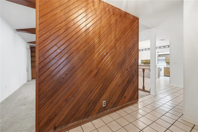 a room with furniture a mirror and a table