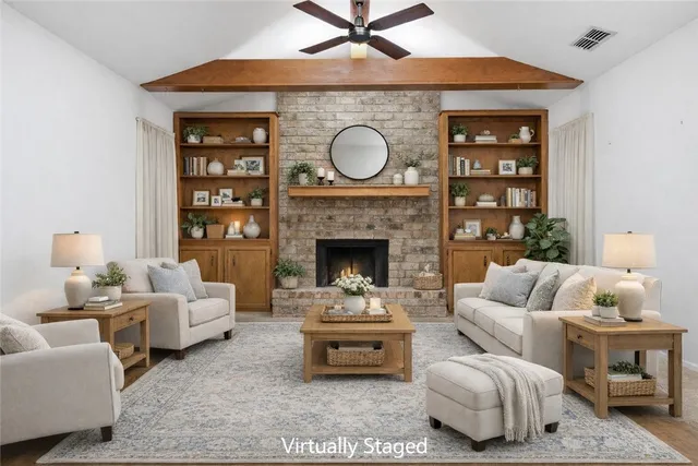 a view of an empty room with a fireplace