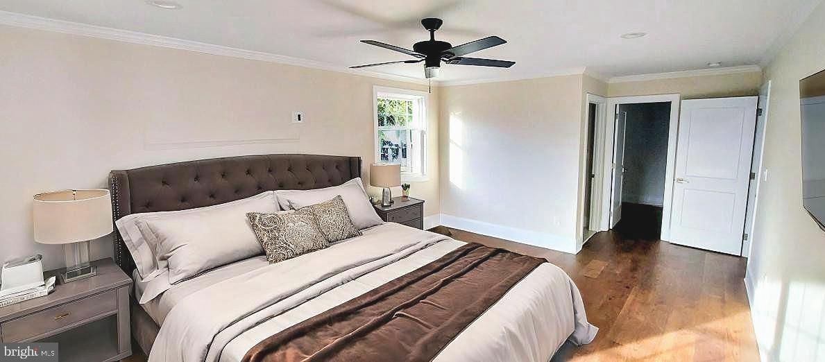 4909 Threadneedle Road Wilmington, DE 19807 - Photo 11 of 33 a bedroom with a bed and a ceiling fan