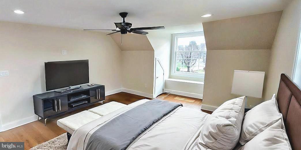 4909 Threadneedle Road Wilmington, DE 19807 - Photo 12 of 33 a bedroom with a bed and a flat screen tv