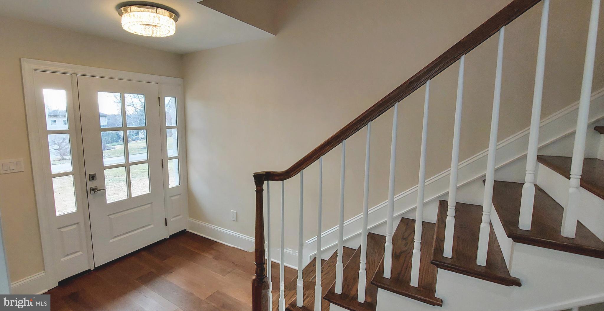 4909 Threadneedle Road Wilmington, DE 19807 - Photo 23 of 33 a view of staircase with wooden floor and white walls