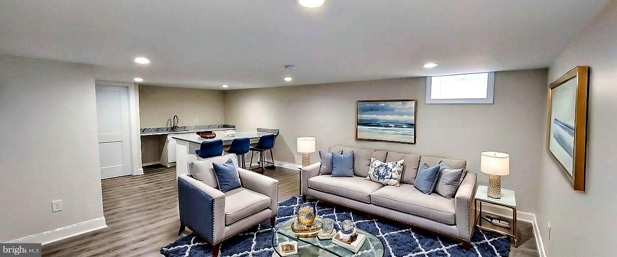 4909 Threadneedle Road Wilmington, DE 19807 - Photo 26 of 33 a living room with furniture and a flat screen tv