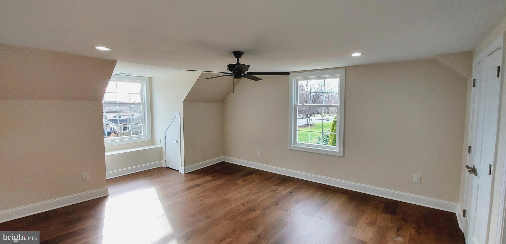 4909 Threadneedle Road Wilmington, DE 19807 - Photo 30 of 33 a view of an empty room with wooden floor and a window