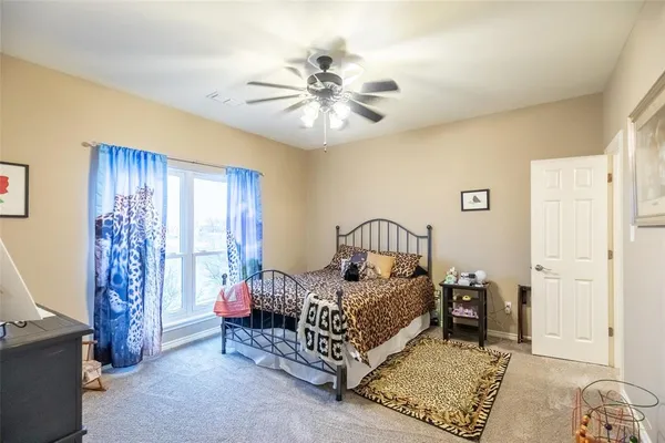 a bed room with a bed and a chandelier