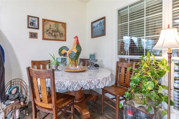 a view of a dining room with furniture and window