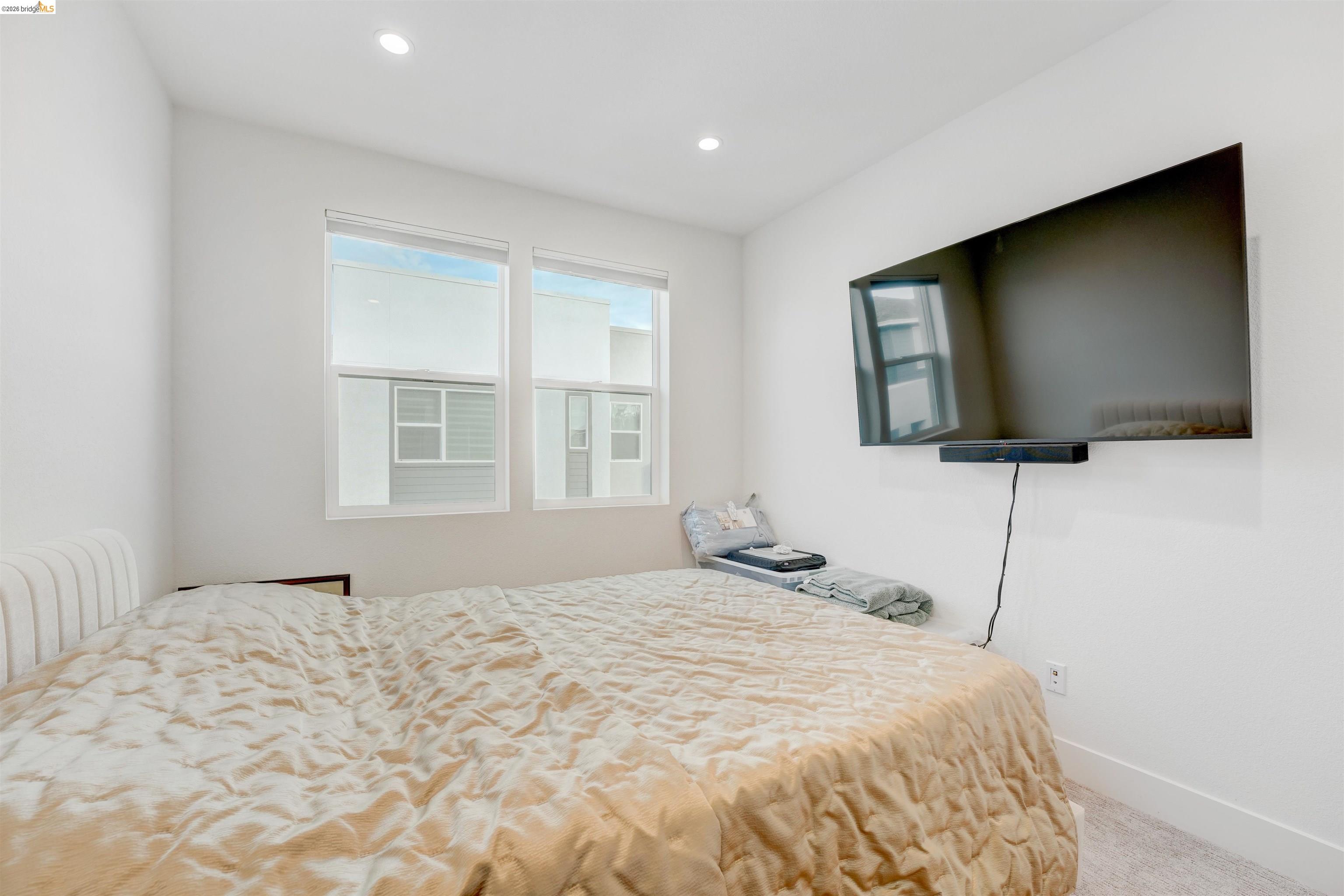 7101 Melon Court San Ramon, CA 94583 - Photo 38 of 58 a bedroom with a bed and a flat screen tv