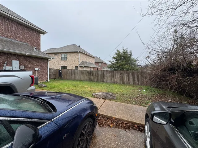 a view of yard with patio