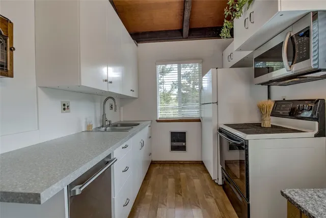 a kitchen with a stove and a sink