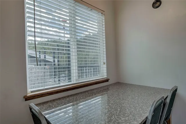 a view of a room that has a window