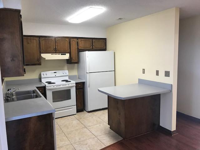 117 Beacons Bend Road Crestview, FL 32536 - Photo 12 of 30 a kitchen with a appliances a sink and a refrigerator