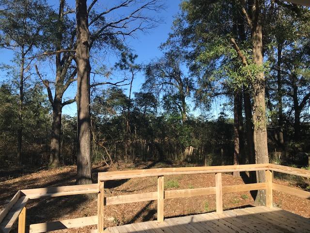 117 Beacons Bend Road Crestview, FL 32536 - Photo 5 of 30 a view of a yard with wooden fence