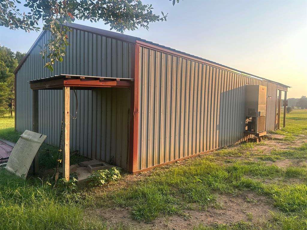 517 Sanders Road Minden, LA 71055 - Photo 11 of 12 a backyard of a house with table and chairs