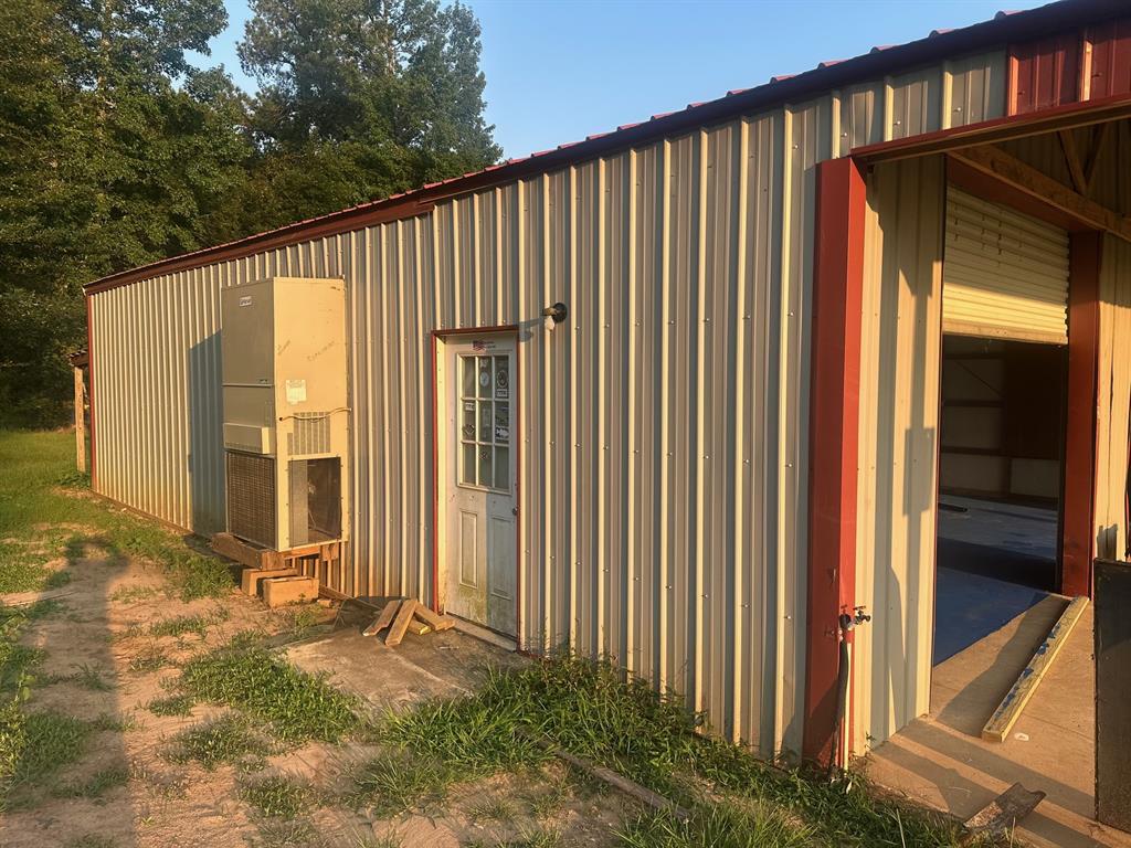517 Sanders Road Minden, LA 71055 - Photo 9 of 12 a view of a house with backyard and sitting area