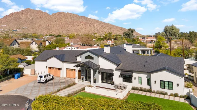a front view of a house with a yard table and chairs