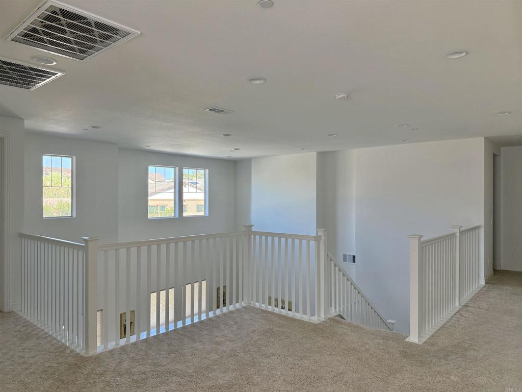 39529 Dayspring Way Temecula, CA 92591 - Photo 19 of 49 a view of an empty room with a window