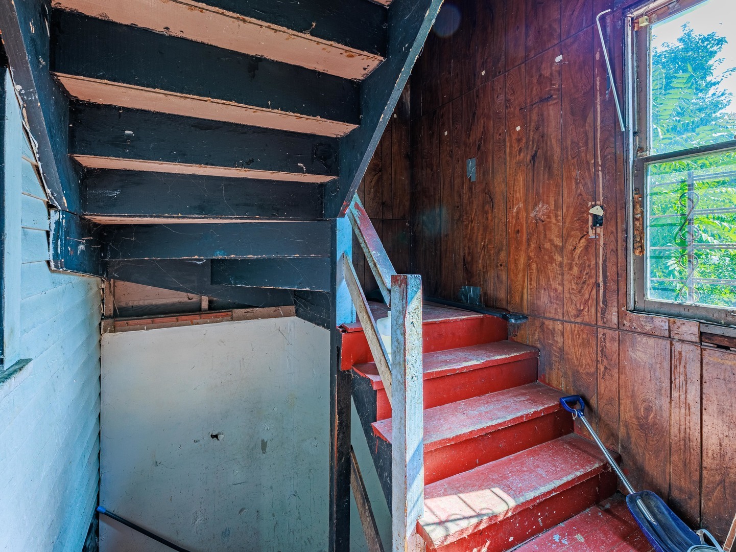 5225 South Wood Street Chicago, IL 60609 - Photo 11 of 14 a view of an empty room with wooden floor and stairs