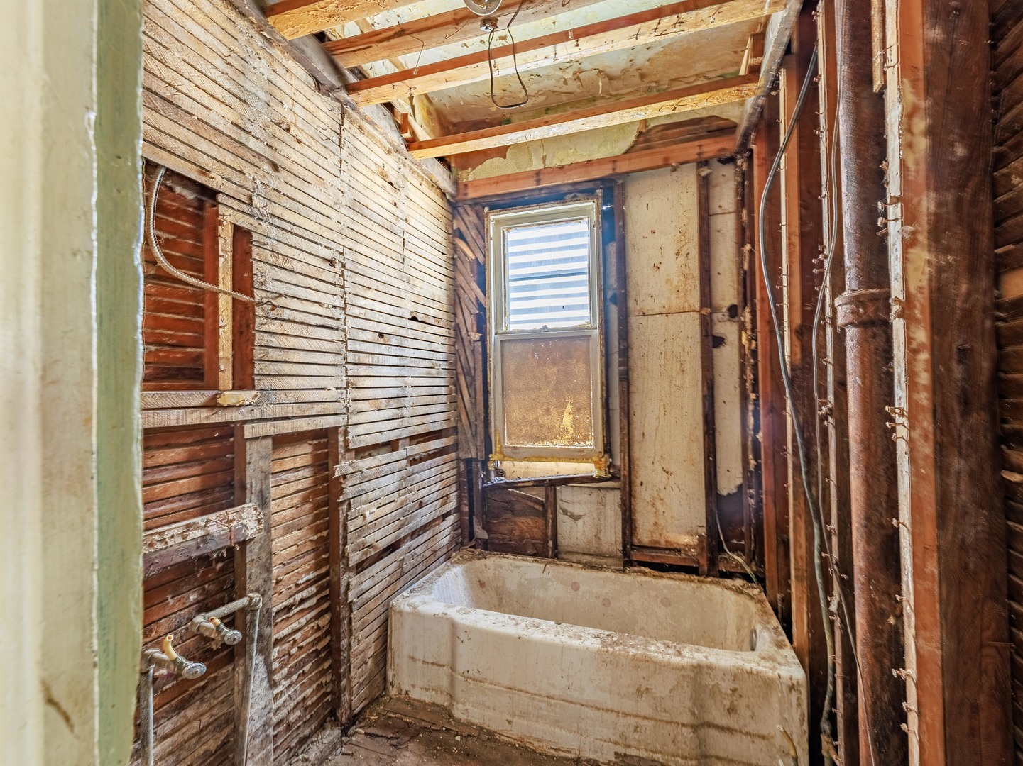5225 South Wood Street Chicago, IL 60609 - Photo 6 of 14 a bathroom with a tub and shower