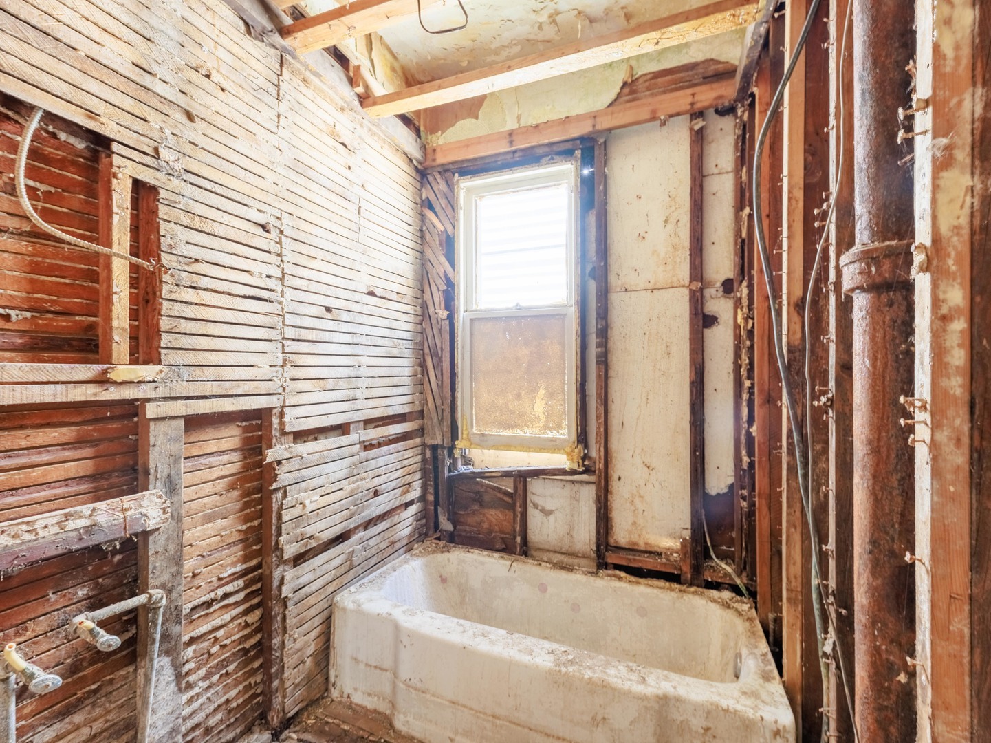 5225 South Wood Street Chicago, IL 60609 - Photo 7 of 14 a bathroom with a bathtub and shower