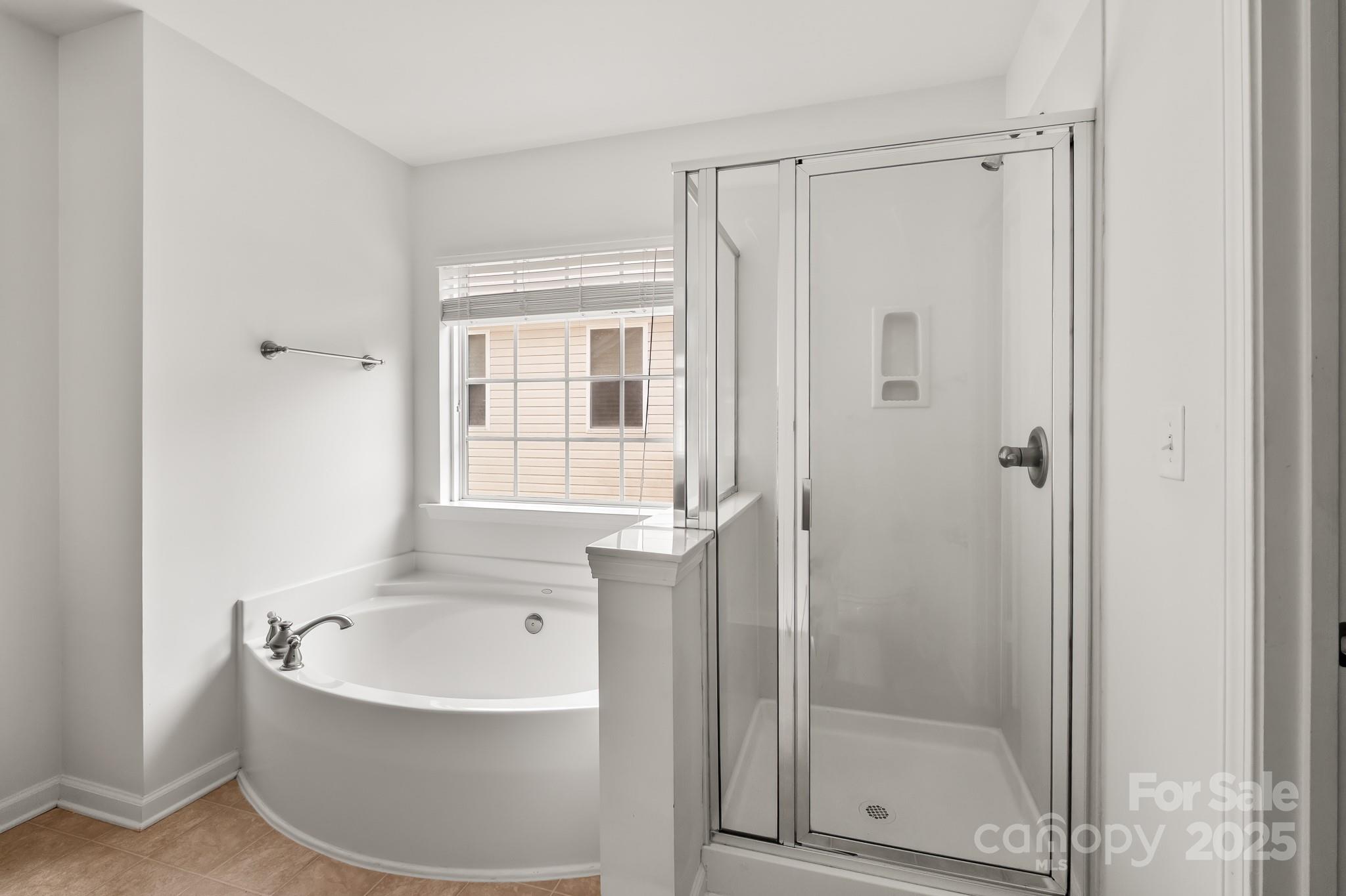 9607 Seamill Road Charlotte, NC 28278 - Photo 11 of 18 a bathroom with a bathtub and shower