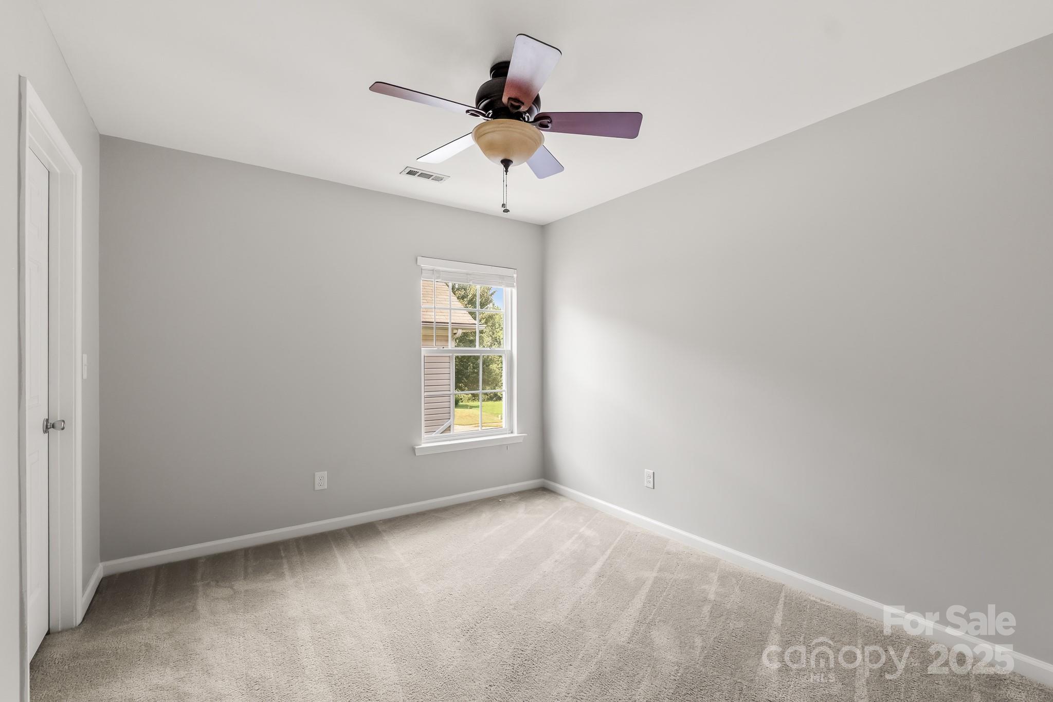 9607 Seamill Road Charlotte, NC 28278 - Photo 13 of 18 an empty room with a window