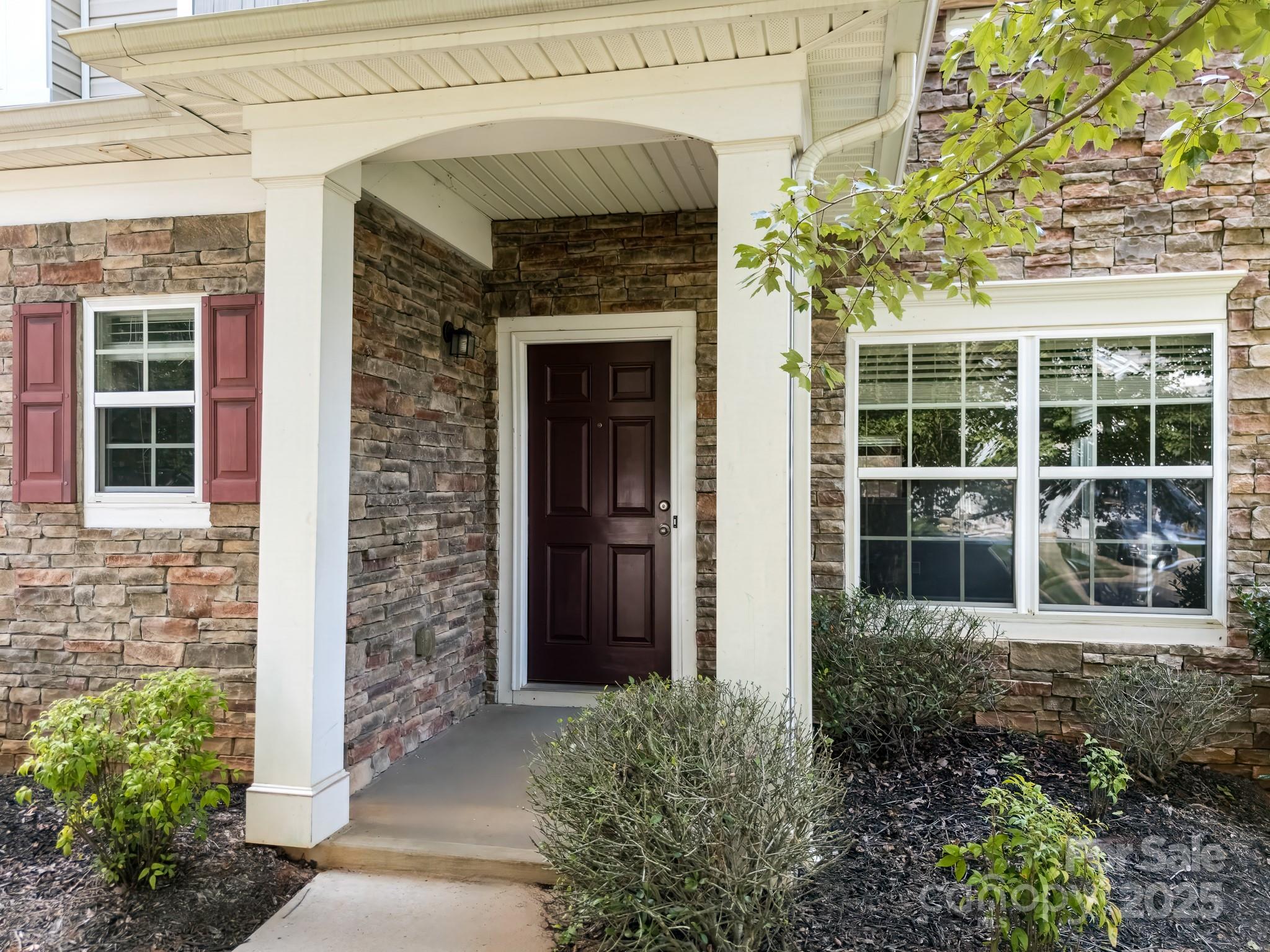 9607 Seamill Road Charlotte, NC 28278 - Photo 2 of 18 a front view of a house with a yard