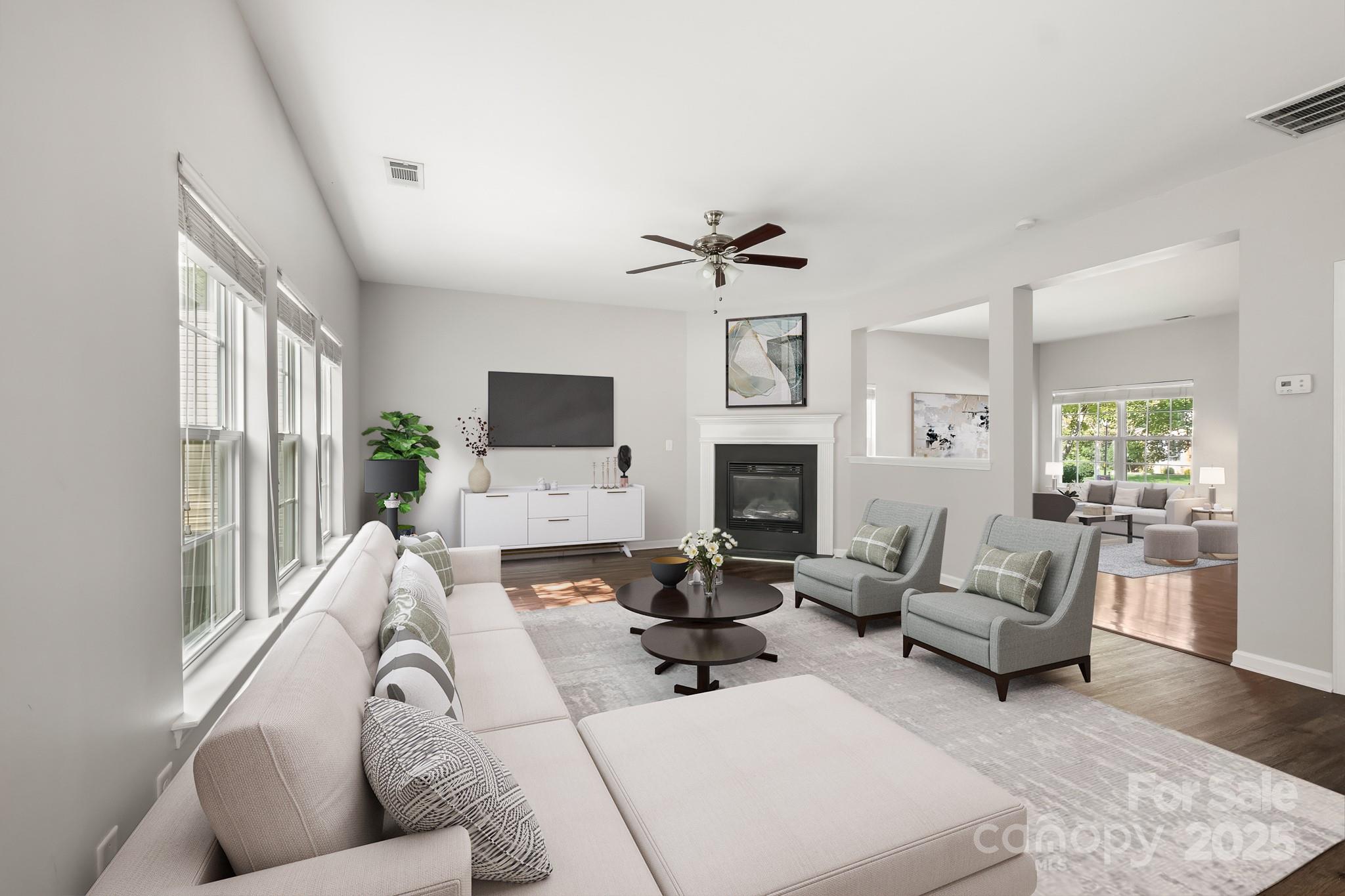 9607 Seamill Road Charlotte, NC 28278 - Photo 7 of 18 a living room with furniture a fireplace and a flat screen tv