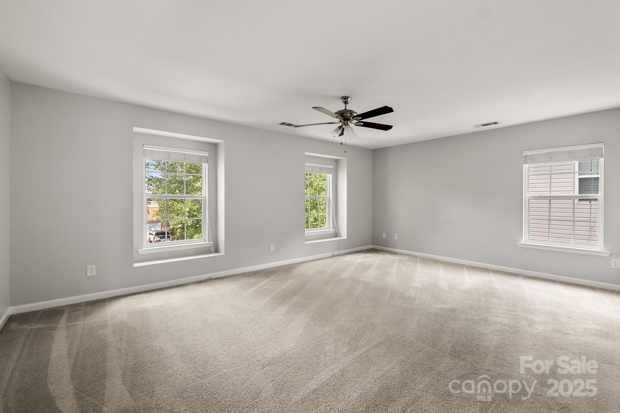 9607 Seamill Road Charlotte, NC 28278 - Photo 9 of 18 a view of an empty room with a window