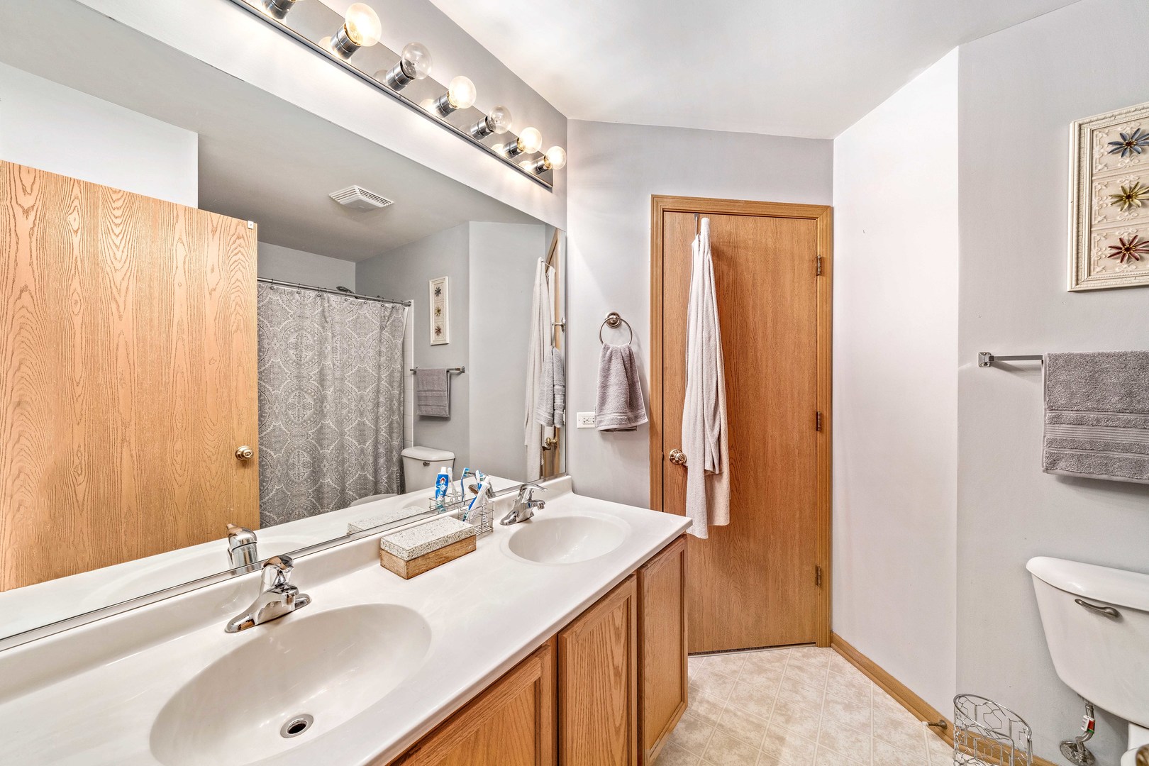 26 Rolling Oaks Road, Unit B Sugar Grove, IL 60554 - Photo 14 of 17 a bathroom with a sink double vanity and a toilet