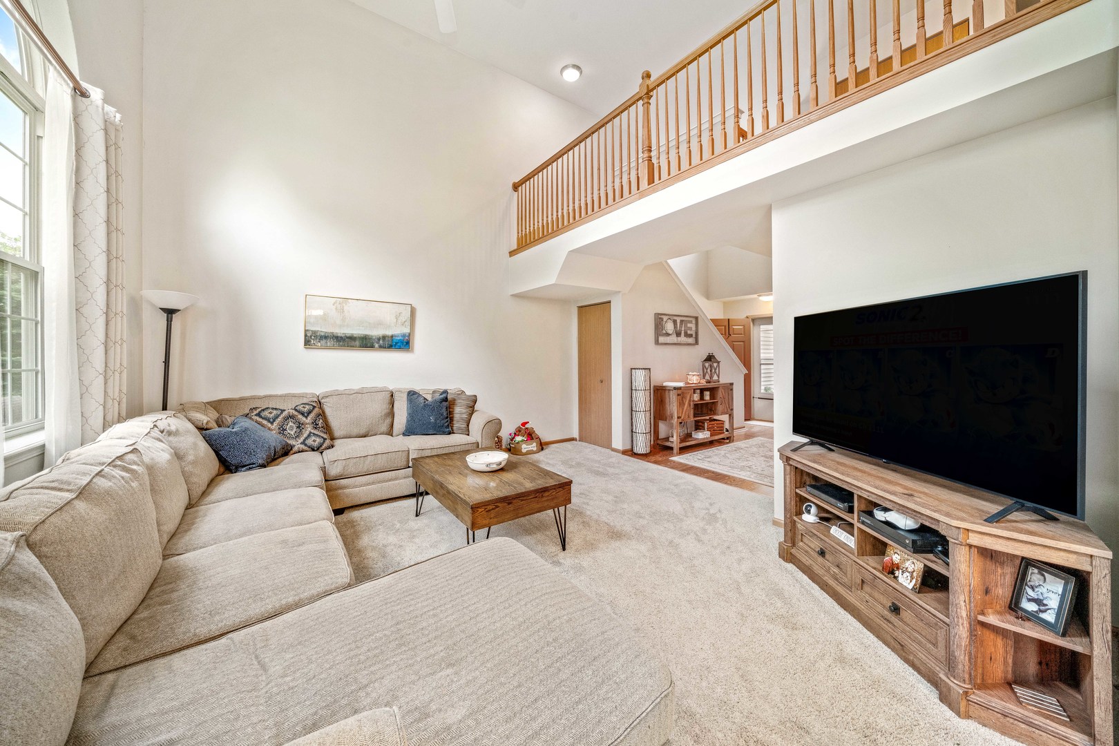 26 Rolling Oaks Road, Unit B Sugar Grove, IL 60554 - Photo 4 of 17 a living room with furniture and a flat screen tv