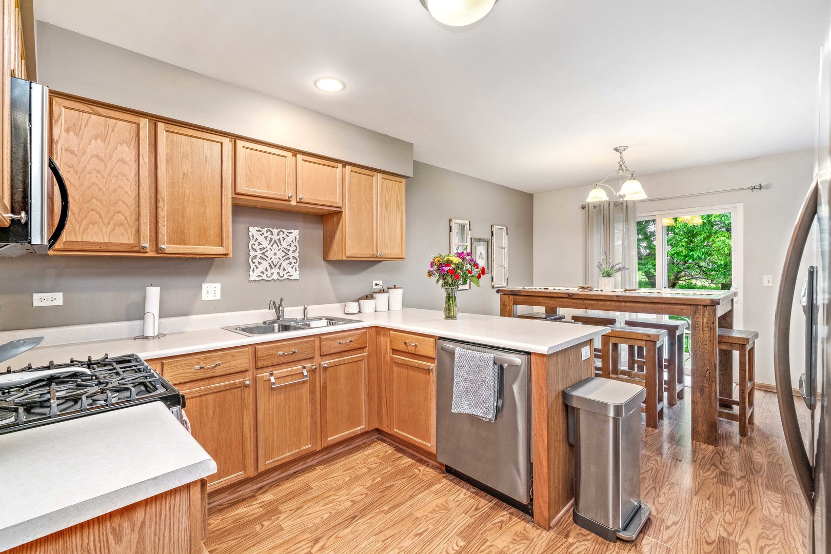 26 Rolling Oaks Road, Unit B Sugar Grove, IL 60554 - Photo 9 of 17 a kitchen with a sink stove and cabinets