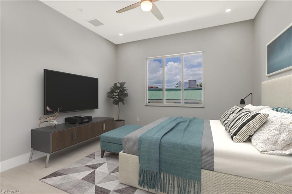 1395 Curlew Avenue, Unit 43 Naples, FL 34102 - Photo 12 of 31 a bedroom with a bed and a flat screen tv