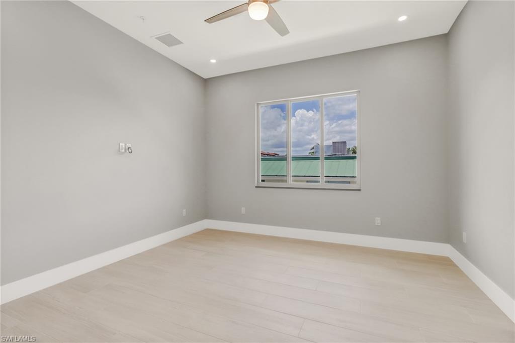 1395 Curlew Avenue, Unit 43 Naples, FL 34102 - Photo 13 of 31 an empty room with a window